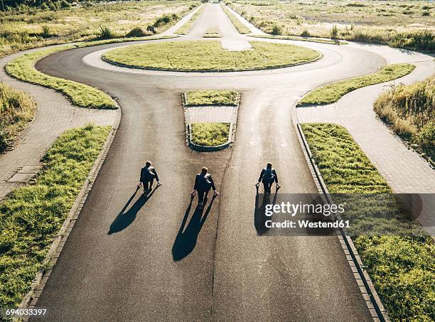 three businessmen starting race at roundabout - championship round three stock pictures, royalty-free photos & images