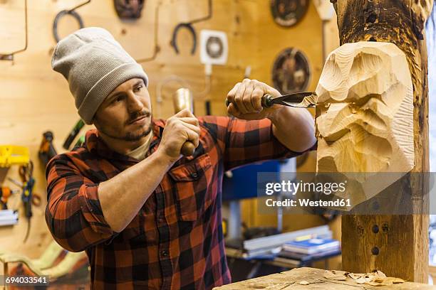 wood carver manufacturing traditional krampus mask - krampus stock pictures, royalty-free photos & images