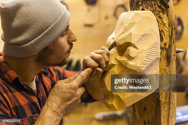 wood carver manufacturing traditional krampus mask - krampus stock pictures, royalty-free photos & images
