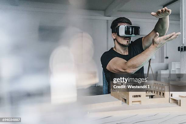 man with architectural model and vr glasses - future fotografías e imágenes de stock