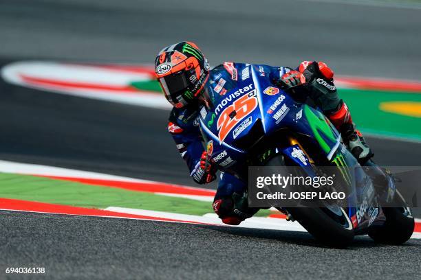 Movistar Yamaha MotoGP's Spanish rider Maverick Vinales takes a chicane during the first MotoGP free practice session of the Moto Grand Prix de...