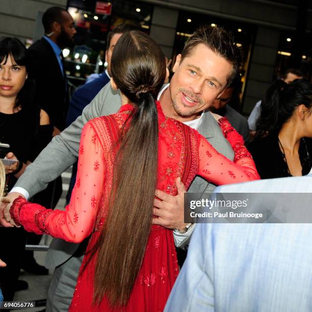 Lily Collins and Brad Pitt attend Netflix hosts the New York Premiere of "Okja" at AMC Lincoln Square Theater on June 8, 2017 in New York City.