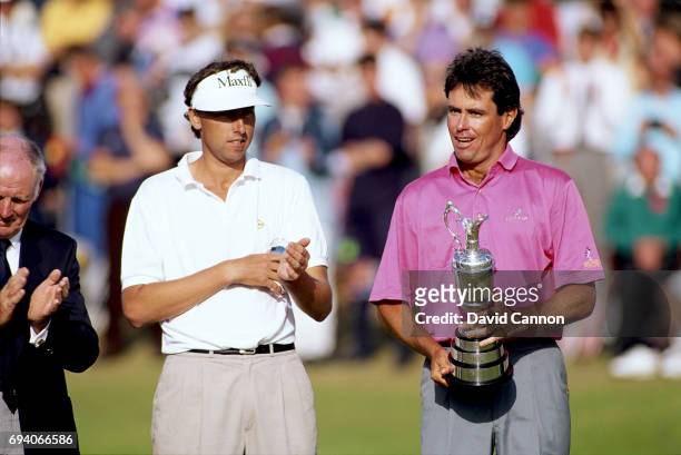 Ian Baker-Finch of Australia with runner-up Mike Harwood of Australia during the presentation after the final round of the 120th Open Championship at...
