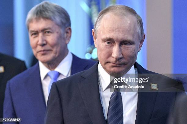 President Vladimir Putin and Kyrgyzstan's President Almazbek Atambayev are seen ahead of a meeting of the Shanghai Cooperation Organisation Heads of...