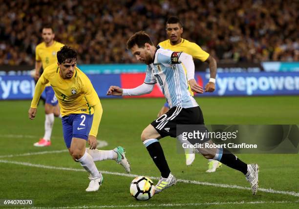 Lionel Messi of Argentina runs with the ball during the Brazil Global Tour match between Brazil and Argentina at Melbourne Cricket Ground on June 9,...