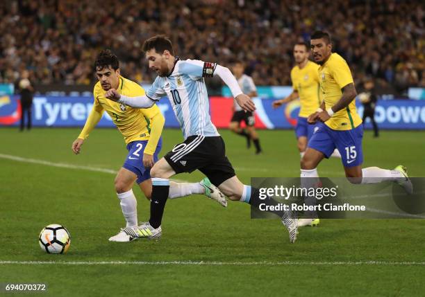 Lionel Messi of Argentina runs with the ball during the Brazil Global Tour match between Brazil and Argentina at Melbourne Cricket Ground on June 9,...