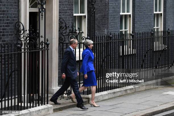 Prime Minister Theresa May leaves Downing Street with her husband Philip to go to Buckingham Palace where she will seek the Queen's permission to...