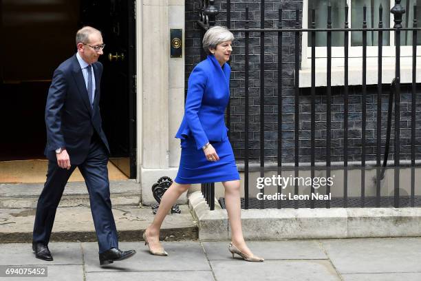 Prime Minister Theresa May leaves Downing Street with her husband Philip to go to Buckingham Palace where she will seek the Queen's permission to...