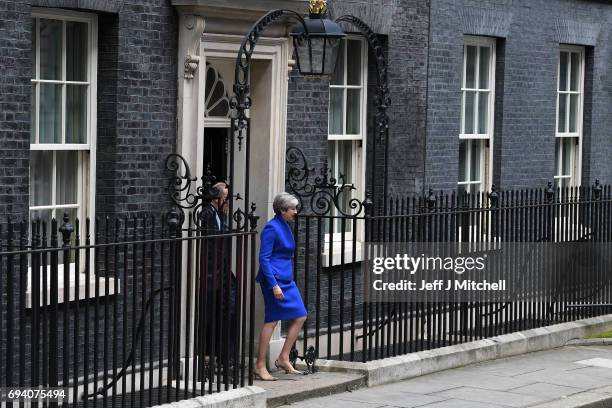 Prime Minister Theresa May leaves Downing Street with her husband Philip to go to Buckingham Palace where she will seek the Queen's permission to...