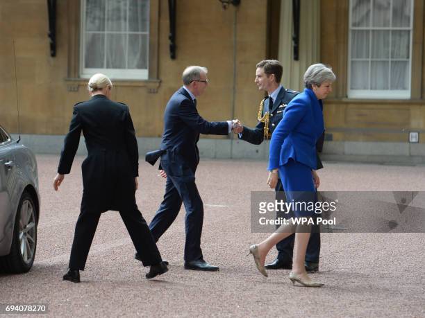 Prime Minister Theresa May with her husband Philip arrives at Buckingham Palace where she will seek the Queen's permission to form a UK government on...