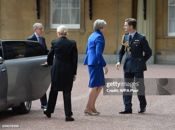 Prime Minister Theresa May with her husband Philip arrives at Buckingham Palace where she will seek the Queen's permission to form a UK government on...