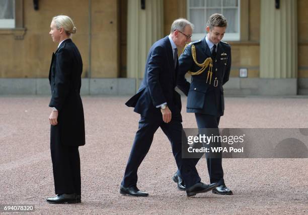 Prime Minister Theresa May's husband Philip arrives at Buckingham Palace where the Prime Minister will seek the Queen's permission to form a UK...