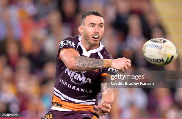 Darius Boyd of the Broncos passes the ball during the round 14 NRL match between the Brisbane Broncos and the South Sydney Rabbitohs at Suncorp...