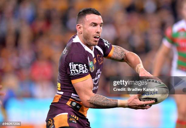 Darius Boyd of the Broncos passes the ball during the round 14 NRL match between the Brisbane Broncos and the South Sydney Rabbitohs at Suncorp...