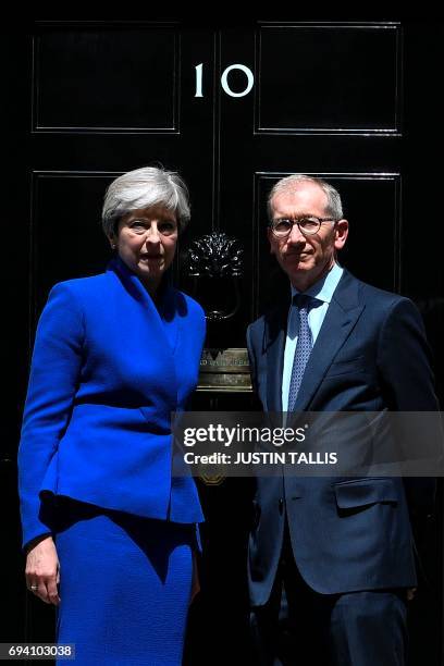 Britain's Prime Minister and leader of the Conservative Party Theresa May, , accompanied by her husband Philip , pose after the prime minister...