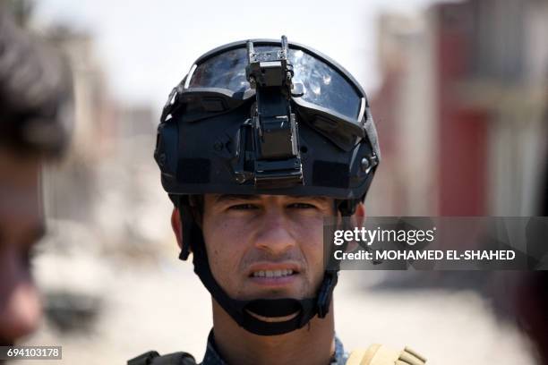 Iraqi government forces patrols in western Mosul's Zanjili neighbourhood on June 9 during ongoing battles to retake the city from Islamic State group...