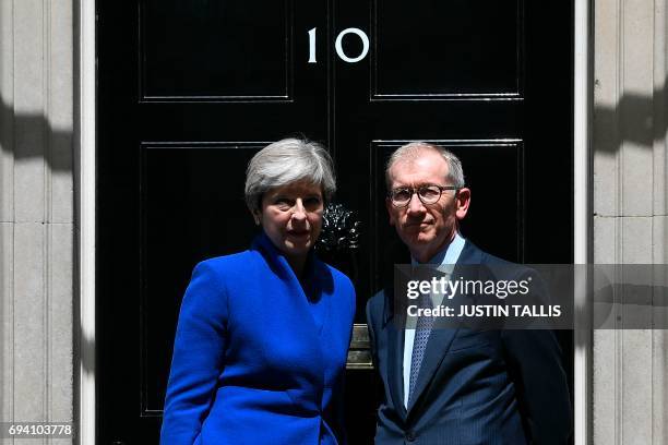 Britain's Prime Minister and leader of the Conservative Party Theresa May, , accompanied by her husband Philip , pose after the prime minister...