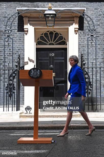 Britain's Prime Minister and leader of the Conservative Party Theresa May approaches the lecturn to deliver a statement outside 10 Downing Street in...