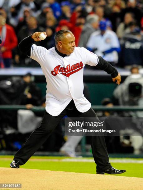 Former Cleveland Indians outfielder Carlos Baerga throws the ceremonial first pitch prior to Game 2 of the World Series on October 26, 2016 between...