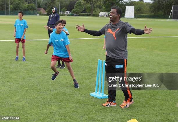 Muttiah Muralitharan celebrates taking the winning wicket as he plays a cricket game with kids from a local school during the ICC Cricket For Good...