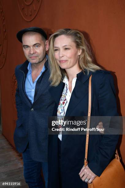 Actors Clovis Cornillac and his wife Lilou Fogli attend the 2017 French Tennis Open - Day Thirteen at Roland Garros on June 9, 2017 in Paris, France.