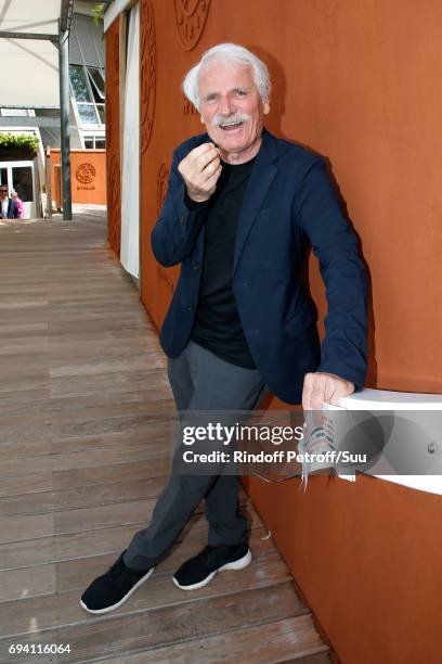 Photographer Yann Arthus-Bertrand attends the 2017 French Tennis Open - Day Thirteen at Roland Garros on June 9, 2017 in Paris, France.