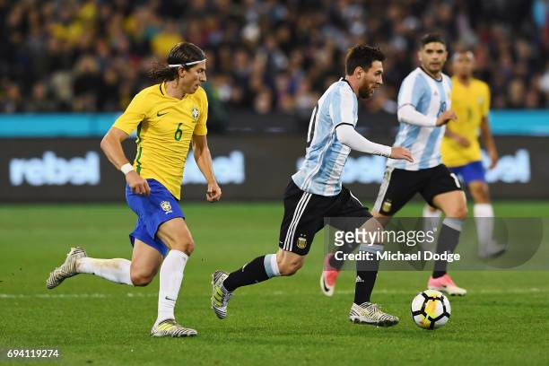 Lionel Messi of Argentina controls fo the ball against Filipe Luis of Brazil during the Brasil Global Tour match between Brazil and Argentina at...