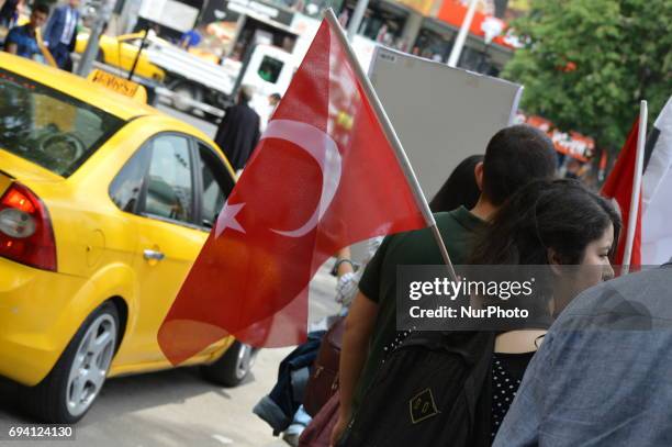 Woman holds a Turkish flag during a protest against the U.S. And its army at the Incirlik Air Base in Ankara, Turkey on June 8, 2017.