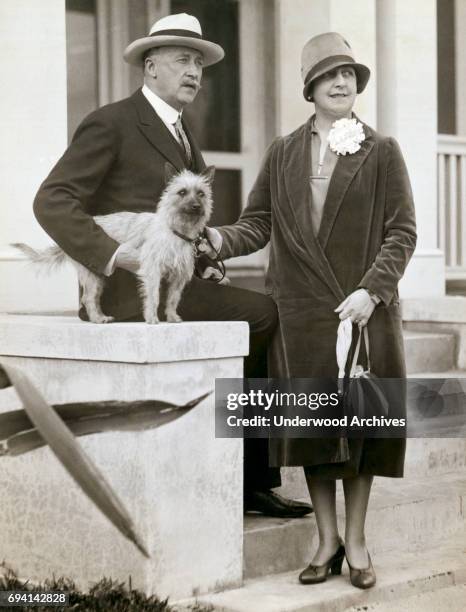 Sewing machine magnate PE Singer and his wife, Cecilia, as they pose on concrete steps, Palm Beach, Florida, January 18, 1927.