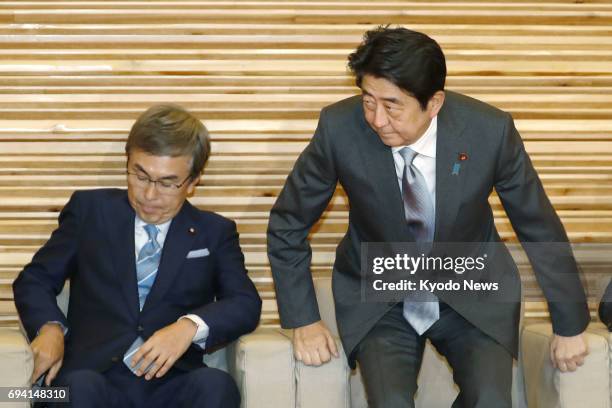 Japanese Prime Minister Shinzo Abe attends a Cabinet meeting in Tokyo on June 9 2017, together with Economic and Fiscal Policy Minister Nobuteru...