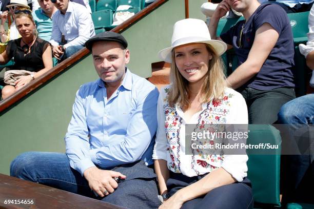 Actors Clovis Cornillac and his wife Lilou Fogli attend the 2017 French Tennis Open - Day Thirteen at Roland Garros on June 9, 2017 in Paris, France.
