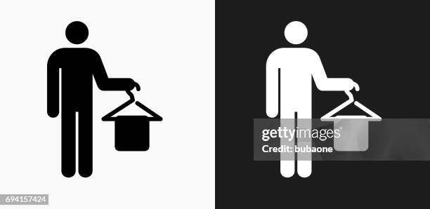 holding clothes hanger icon on black and white vector backgrounds - white hangar stock illustrations