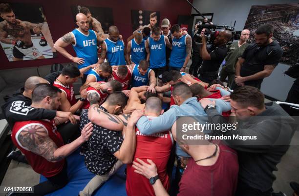 Team Garbrandt and Team Dillashaw join together in prayer during the filming of The Ultimate Fighter: Redemption at the UFC TUF Gym on February 14,...