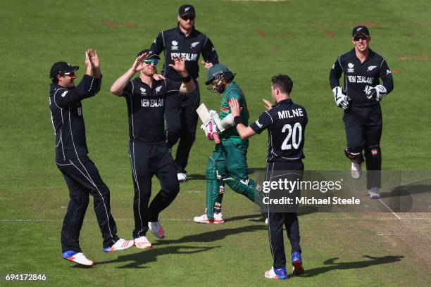 Mushfiqur Rahim of Bangladesh heads back to the pavillion after being bowled by Adam Milne of New Zealand during the ICC Champions Trophy match...