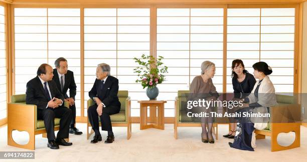 Vietnamese Prime Minister Nguyen Xuan Phuc and his wife Tran Nguyet Thu talk with Emperor Akihito and Empress Michiko during their meeting at the...