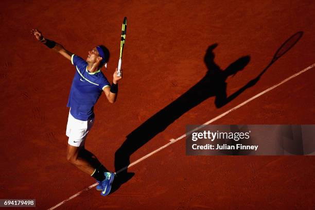 Rafael Nadal of Spain serves during the mens singles semi-final match against Dominic Thiem of Austria on day thirteen of the 2017 French Open at...