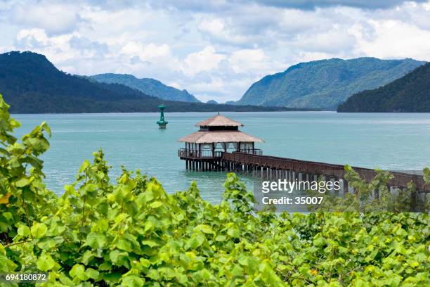 a beautiful dock and cabana on the water - pulau langkawi stock pictures, royalty-free photos & images