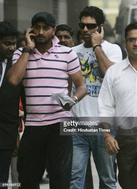 Harbhajan Singh and Yuvraj Singh walk out of Wankhede stadium after taking a look at the renovated stadium on Friday. The duo had earlier visited...