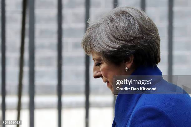 Prime Minister Theresa May arrives back at Downing Street after going to Buckingham Palace where she saught the Queen's permission to form a UK...