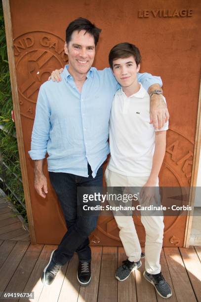 Actor Thomas Gibson and his son Travis Carter Gibson attend the French Tennis Open 2017 - Day Thirteen at Roland Garros on June 9, 2017 in Paris,...