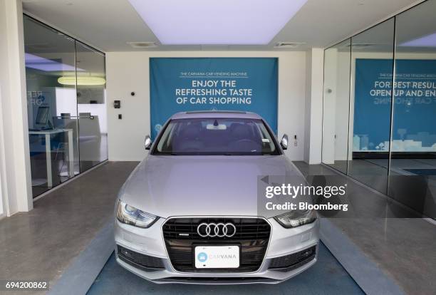 An Audi AG vehicle enters the showroom of the Carvana Co. Car vending machine in Frisco, Texas, U.S., on Thursday, June 8, 2017. The U.S. Automotive...