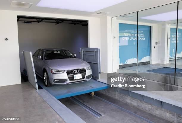 An Audi AG vehicle enters the showroom at the Carvana Co. Car vending machine in Frisco, Texas, U.S., on Thursday, June 8, 2017. The U.S. Automotive...