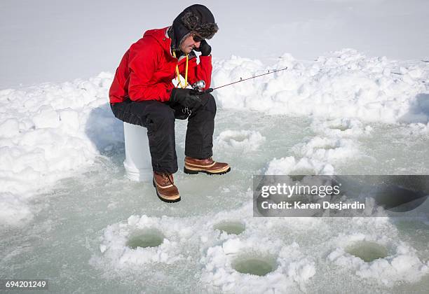 senior man frustrated while ice fishing - deerstalker hat stock pictures, royalty-free photos & images