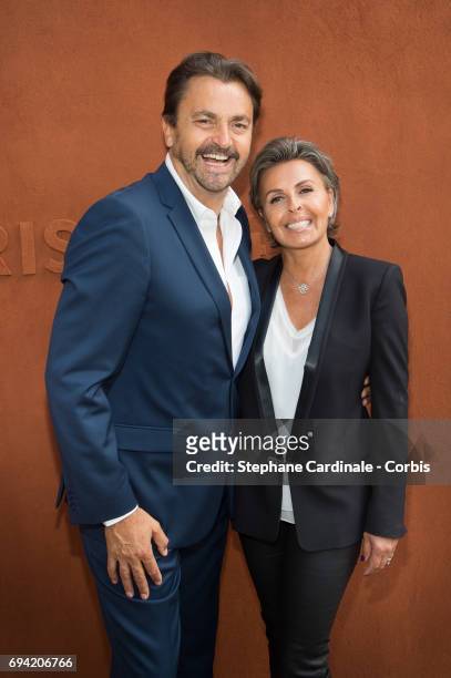 Henri Leconte and Maria Dowlatshahi attend the French Tennis Open 2017 - Day Thirteen at Roland Garros on June 9, 2017 in Paris, France.