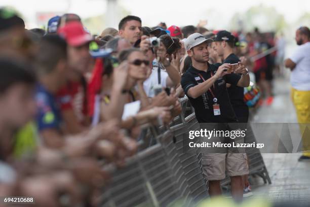 Sandro Cortese of Germany and Dynavolt Intact GP poses with fans during the Pit Lane Walk during the MotoGp of Catalunya - Free Practice at Circuit...