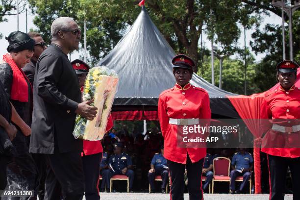 Ghana's former President John Dramani Mahama walks to lay a wreath during a state funeral ceremony for Major Maxwell Mahama on June 9, 2017 in Accra....