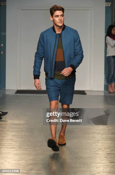 Isaac Carew walks the runway at the Oliver Spencer SS18 Catwalk Show during London Fashion Week Men's June 2017 on June 9, 2017 in London, England.