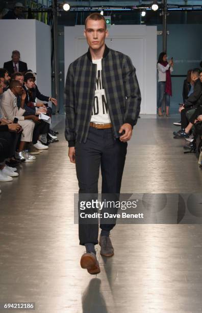 Model walks the runway at the Oliver Spencer SS18 Catwalk Show during London Fashion Week Men's June 2017 on June 9, 2017 in London, England.