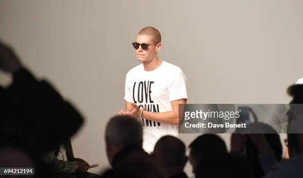 Model walks the runway at the Oliver Spencer SS18 Catwalk Show during London Fashion Week Men's June 2017 on June 9, 2017 in London, England.