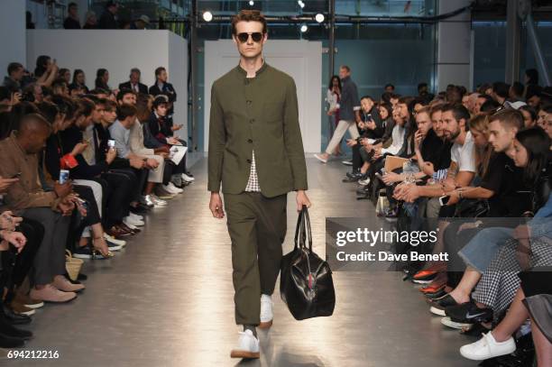 Model walk the runway at the Oliver Spencer SS18 Catwalk Show during London Fashion Week Men's June 2017 on June 9, 2017 in London, England.